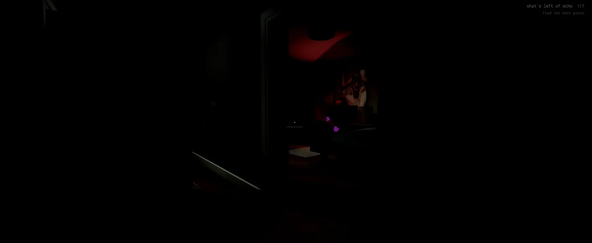 a dark bedroom lit red with echo on the wall